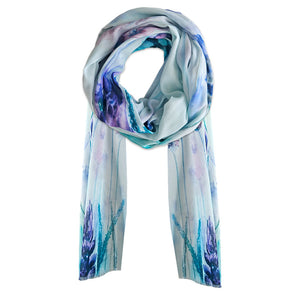 A cotton scarf with soft blue colours and lavender flowers printed on. A cotton scarf with soft blue colours and lavender flowers printed on.