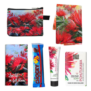 A pohutukawa gift box with tea towel, coin purse, hand cream and soap. A pohutukawa gift box with tea towel, coin purse, hand cream and soap.