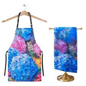 Brighten your kitchen with this stunning Floral Symphony Apron & Tea Towel Duo. Bursting with vibrant hues of cobalt blue, fuchsia pink, and sunshine yellow, this artistic set features a bold hydrangea-inspired design that brings a touch of blooming elegance to everyday tasks. Brighten your kitchen with this stunning Floral Symphony Apron & Tea Towel Duo. Bursting with vibrant hues of cobalt blue, fuchsia pink, and sunshine yellow, this artistic set features a bold hydrangea-inspired design that brings a touch of blooming elegance to everyday tasks.