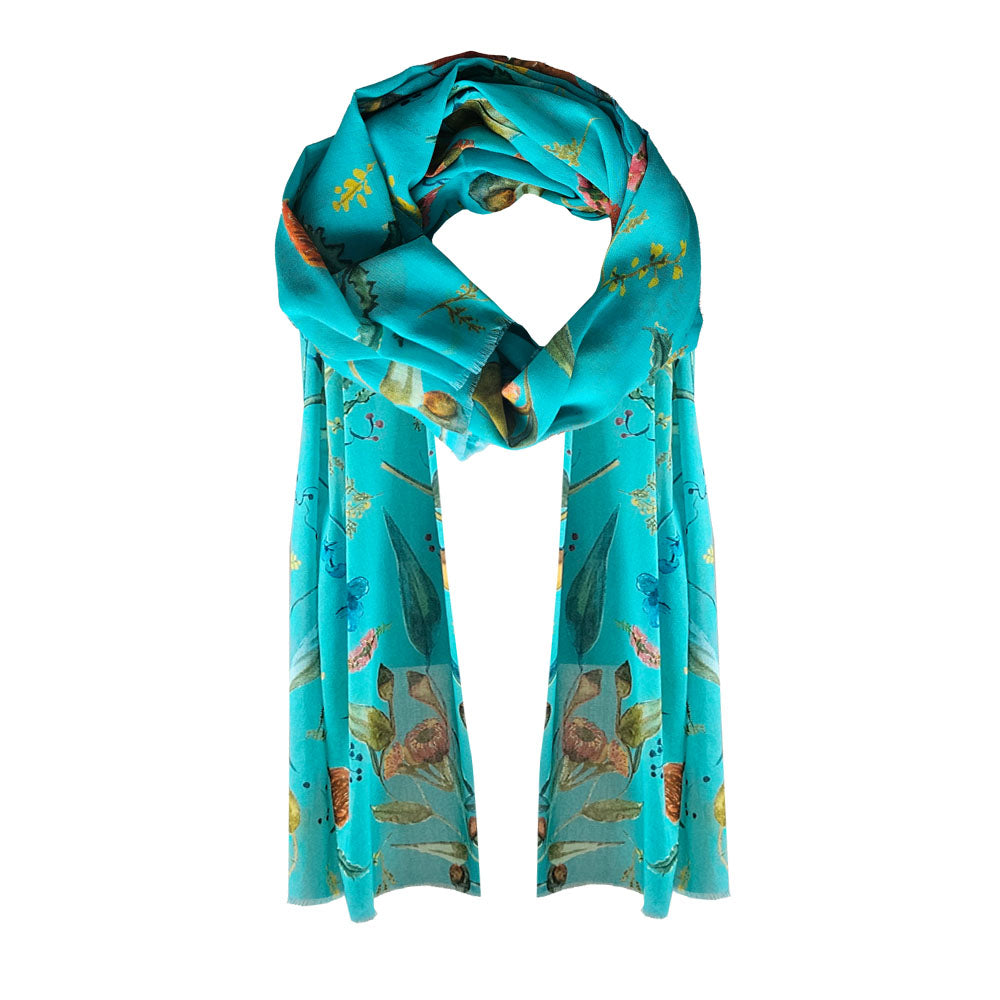 A Aqua coloured Cotton Scarf with Aussie wildflowers printed over it.