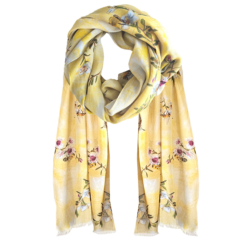 A yellow cotton Scarf with manuka flowers and bees printed