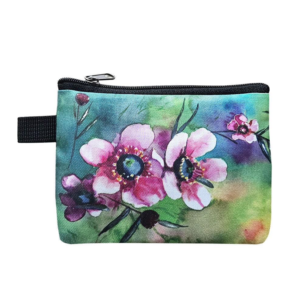 A cute little coin purse with a pink manuka floral print.