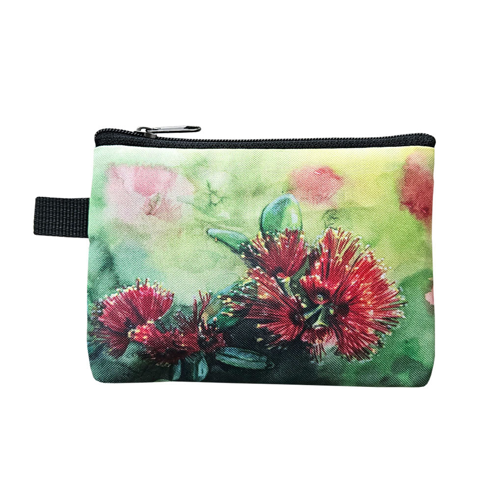 Green and red pohutakawa print coin purse.