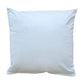 A plain cream velvet cushion.
