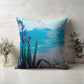 A New Zealand Flax plant by the beach linen cushion.