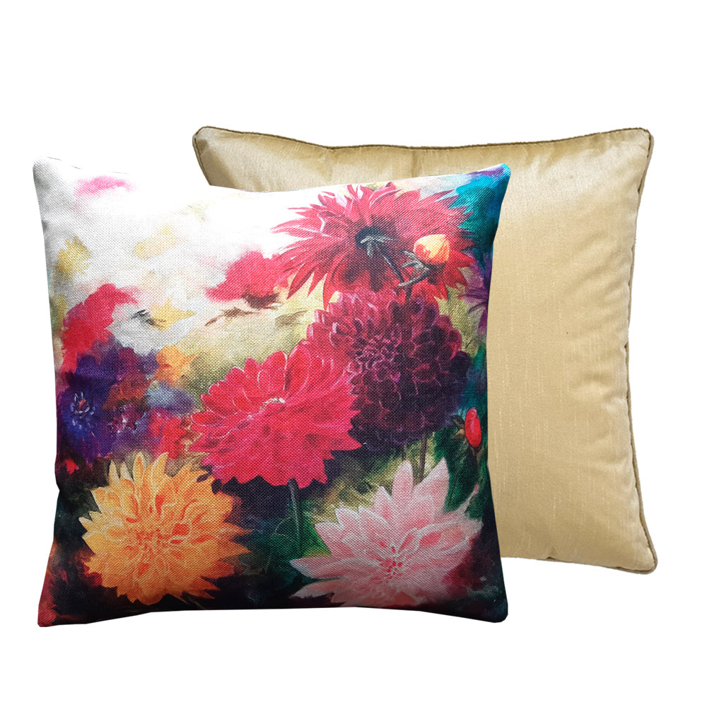 A dahlia print art cushion and gold satin cushion duo.