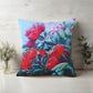 Decorative pillow with floral design on a wooden surface