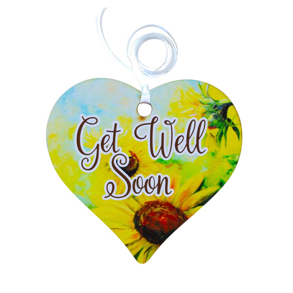A wooden heart gift tag with a daisy illustration and get well soon message written on across the middle.