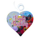 A wooden heart tag with a happy birthday message and floral design.