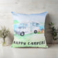 Decorative pillow with 'Happy Campers' design featuring a camper van on a light background.