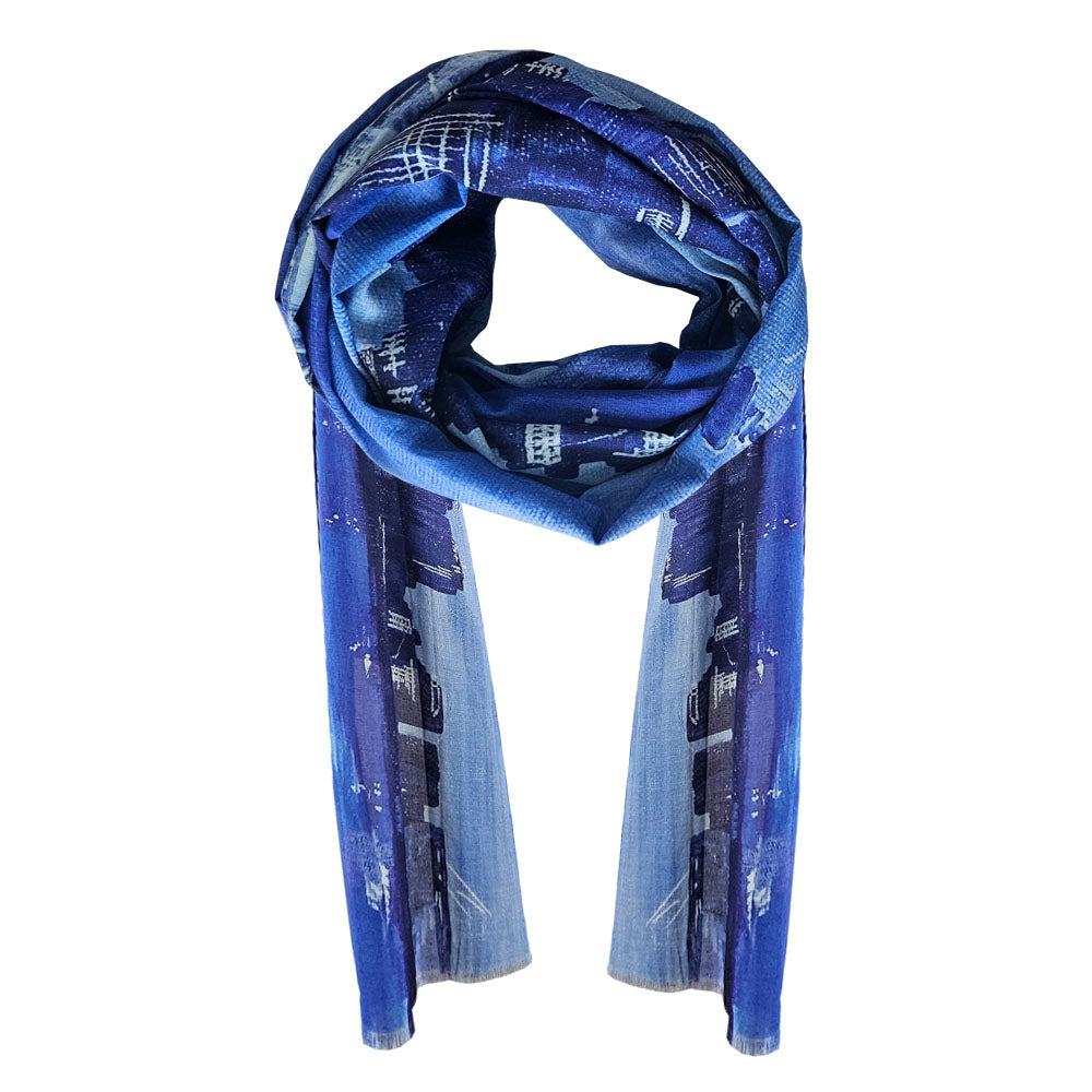 A cotton scarf with a inky night Auckland Skyline design. The white and blues come together to give this scarf a striking design.