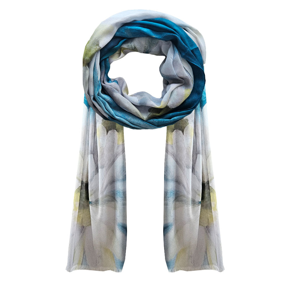 A cotton Scarf with a large soft daisy printed, with blues and white background.