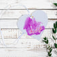 A wooden heart gift tag with a pink bunny illustration and written message of It's a Girl.