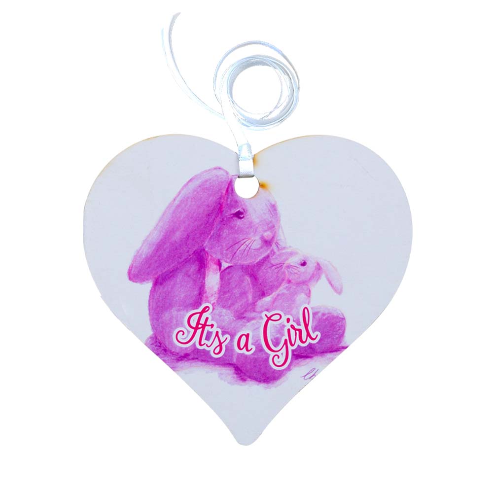 A wooden heart gift tag with a pink bunny illustration and written message of It's a Girl.
