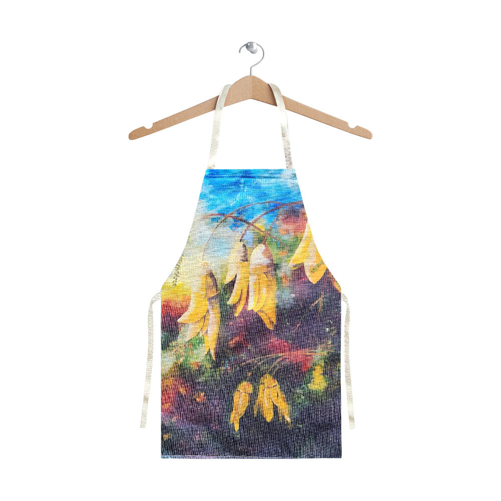A linen look apron with kowhai flowers.