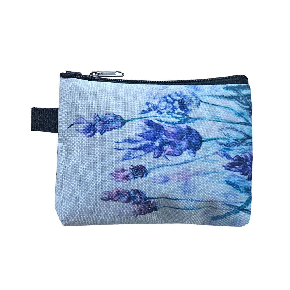 A fabric coin purse with a lavender flower design in blues and purple colours.