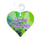 A wooden heart tag with a floral background in greens and purples with a message saying 'Loving Memories'.