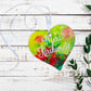 A wooden heart tag  saying Meri Kirihhimete, a kiwi christmas gift tag.