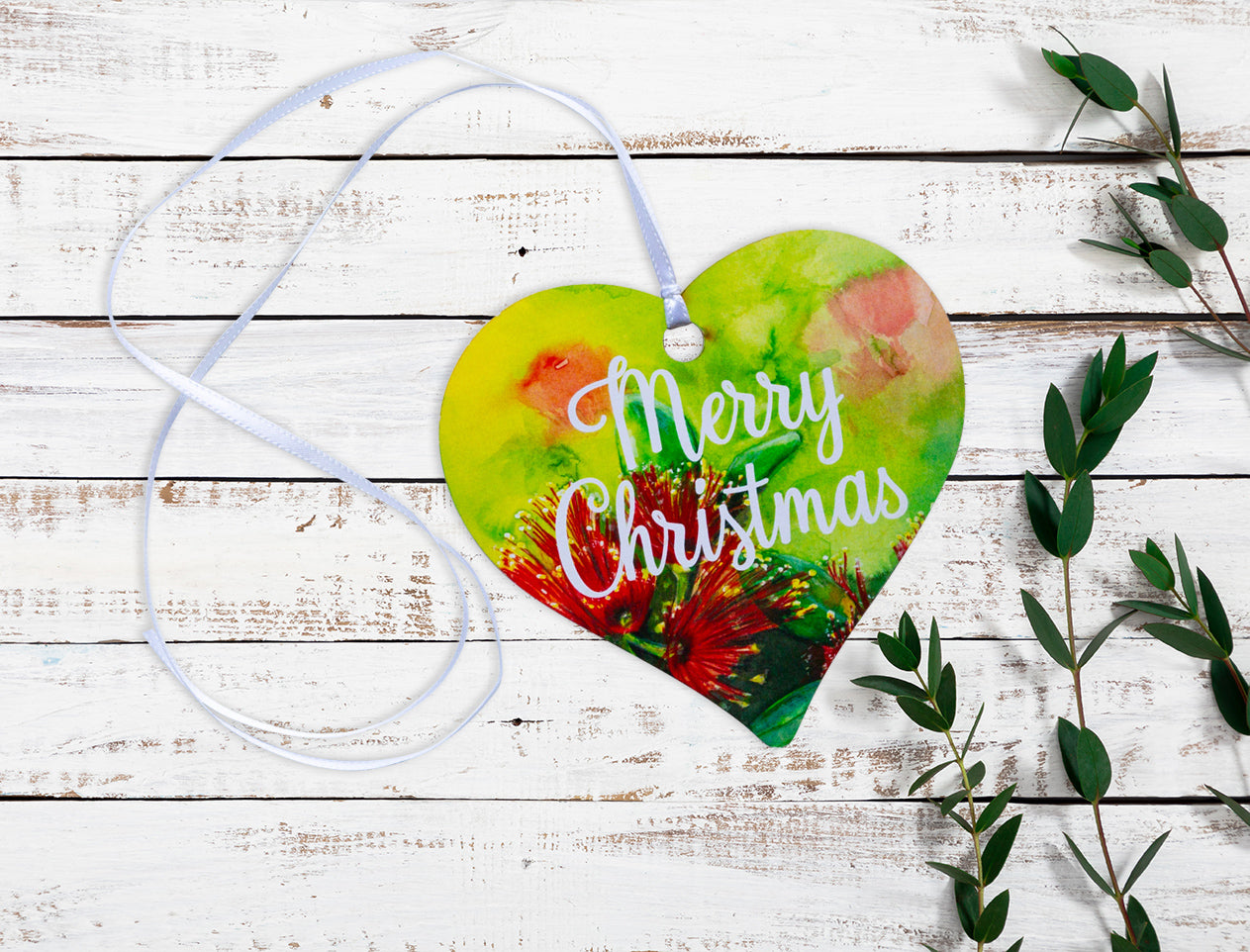 A wooden Merry Christmas Pohutukawa Heart keepsake gift tag