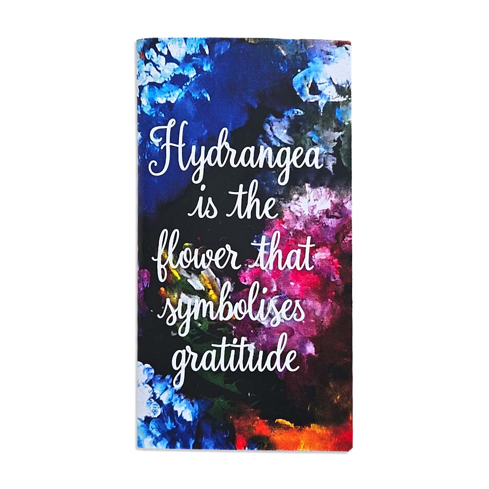 A pocket sizes note book featuring colourful Hydrangeas and an art quote.