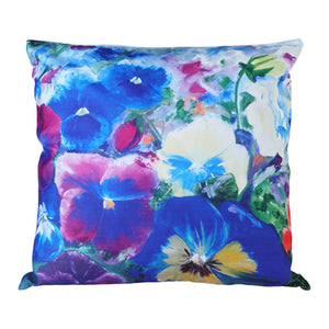 Floral pansies design pillow with vibrant colors on a white background