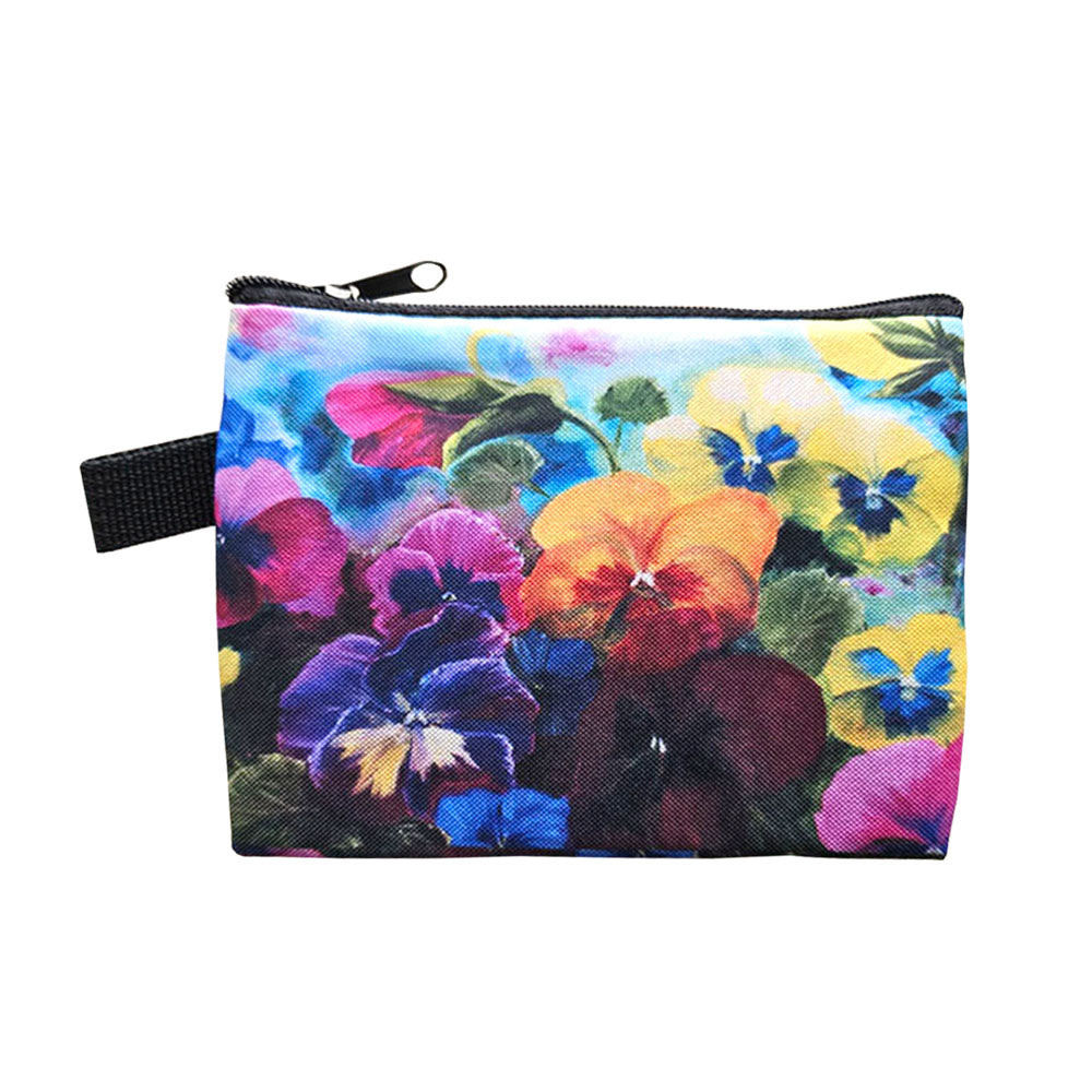A fabric coin purse with a colourful pansy design all over. 