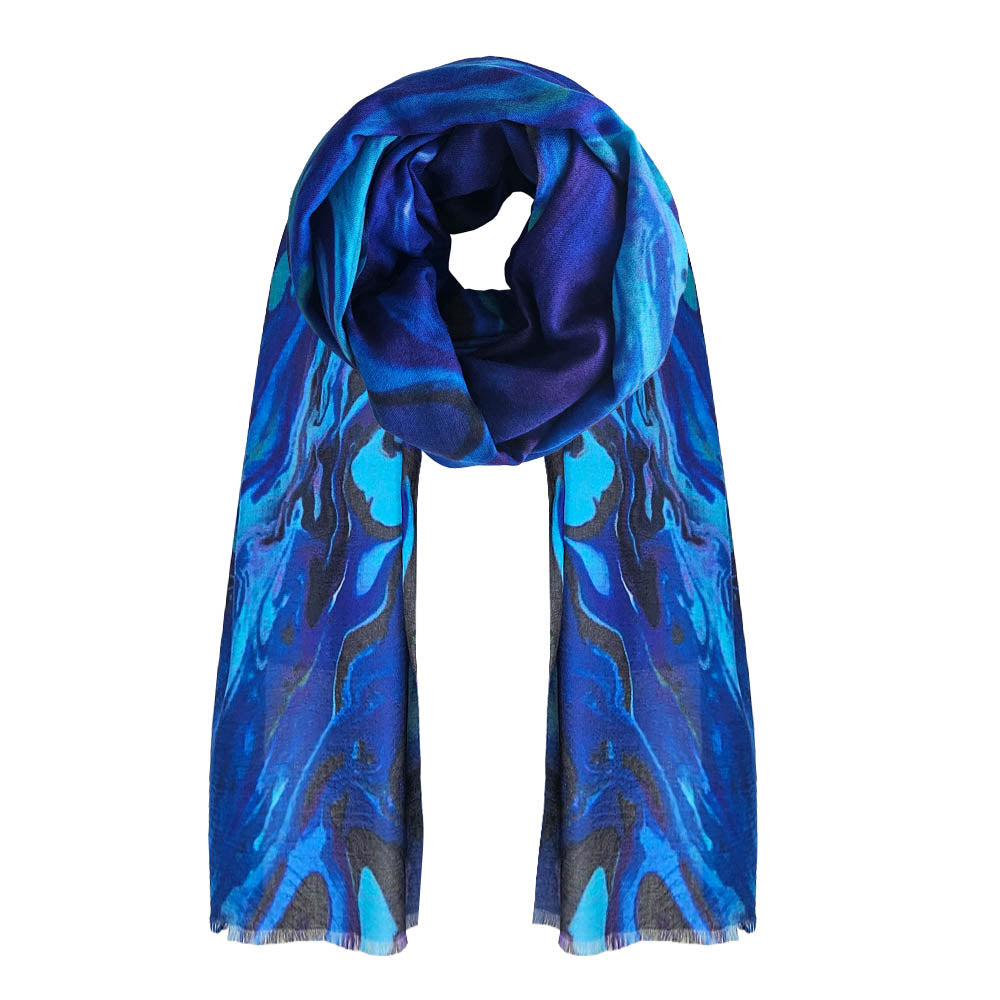 An abstract paua printed cotton scarf. Beautiful shades of blue marble design.
