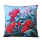Decorative pillow with red floral design on a white background