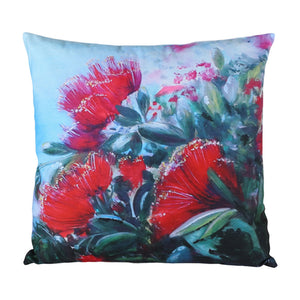 Decorative pillow with red floral design on a white background