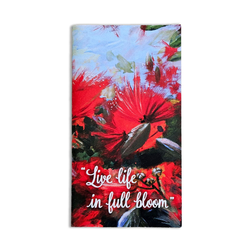A pocket notebook with a pohutukawa design