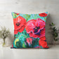 Floral pillow with red and pink flowers on a wooden background