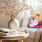 Printed on a stylish linen look fabric, this cushion showcases bright, vibrant blooms that add a fresh and artistic touch to any space.