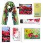 A pohutukawa themed gift box with a merino scarf, a coin purse, hand cream, soap and chocolate.