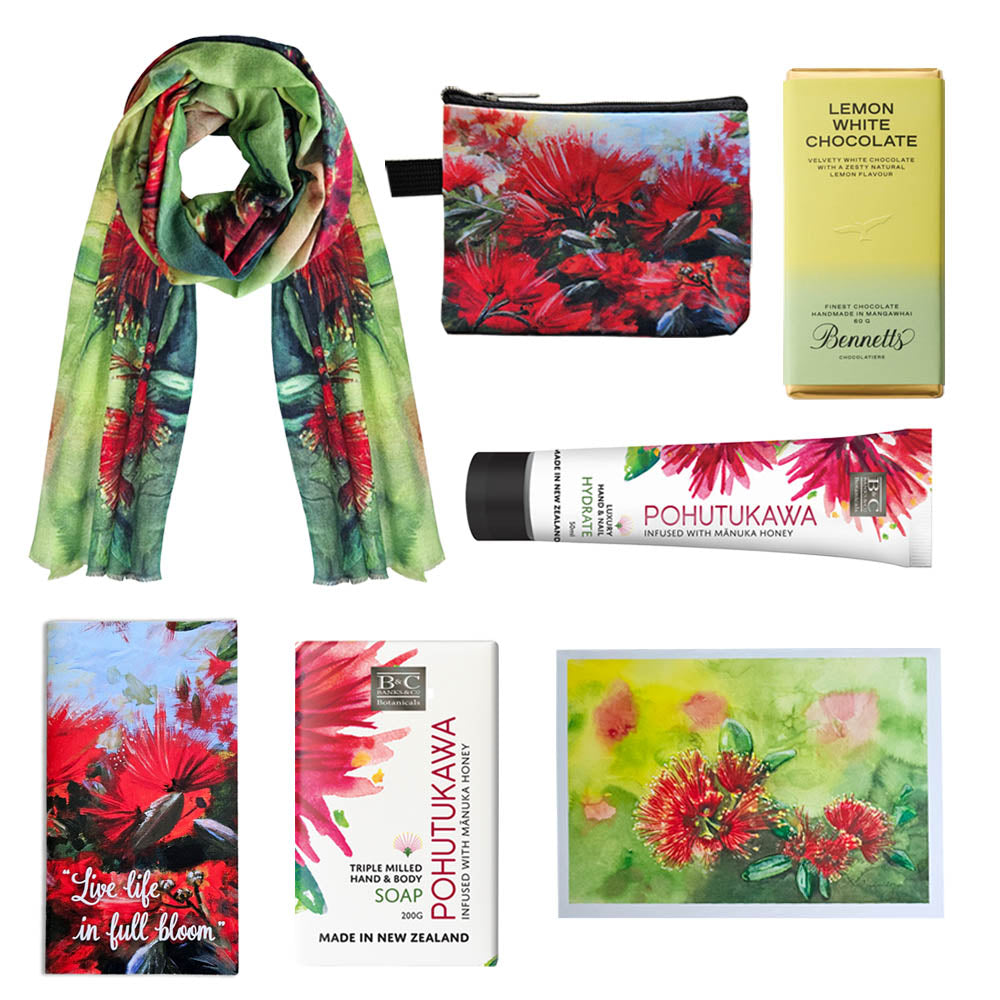 A pohutukawa themed gift box with a merino scarf, a coin purse, hand cream, soap and chocolate.