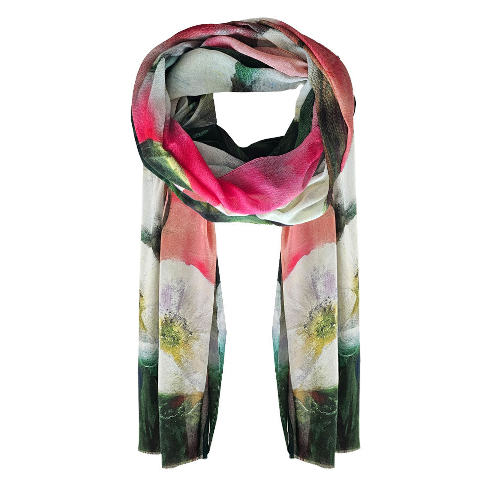 A floral cotton scarf with pinks, whites and green colours. With a white floral design. 