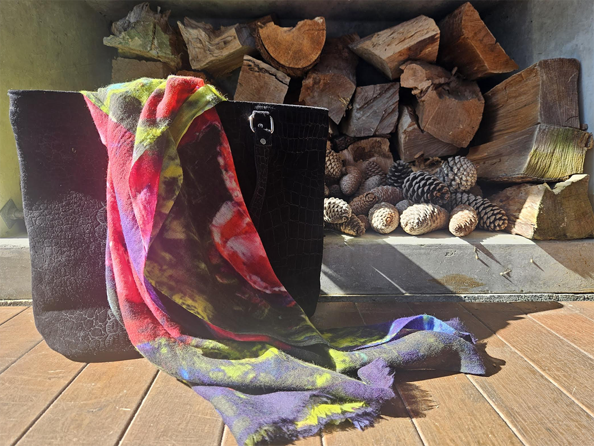 Cotton scarf with red roses printed, a darker colour pallet with red and greens.