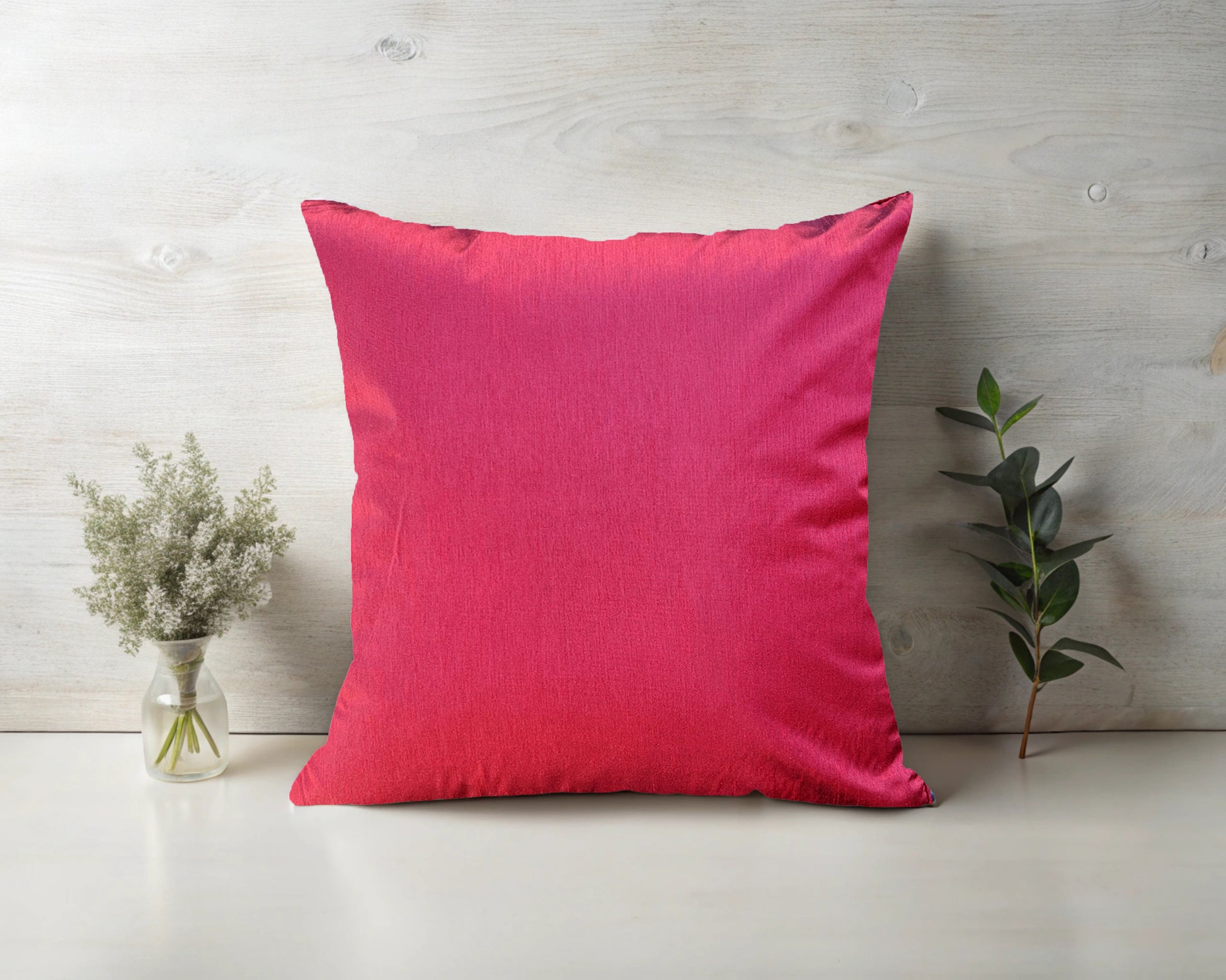 A rich red satin cushion