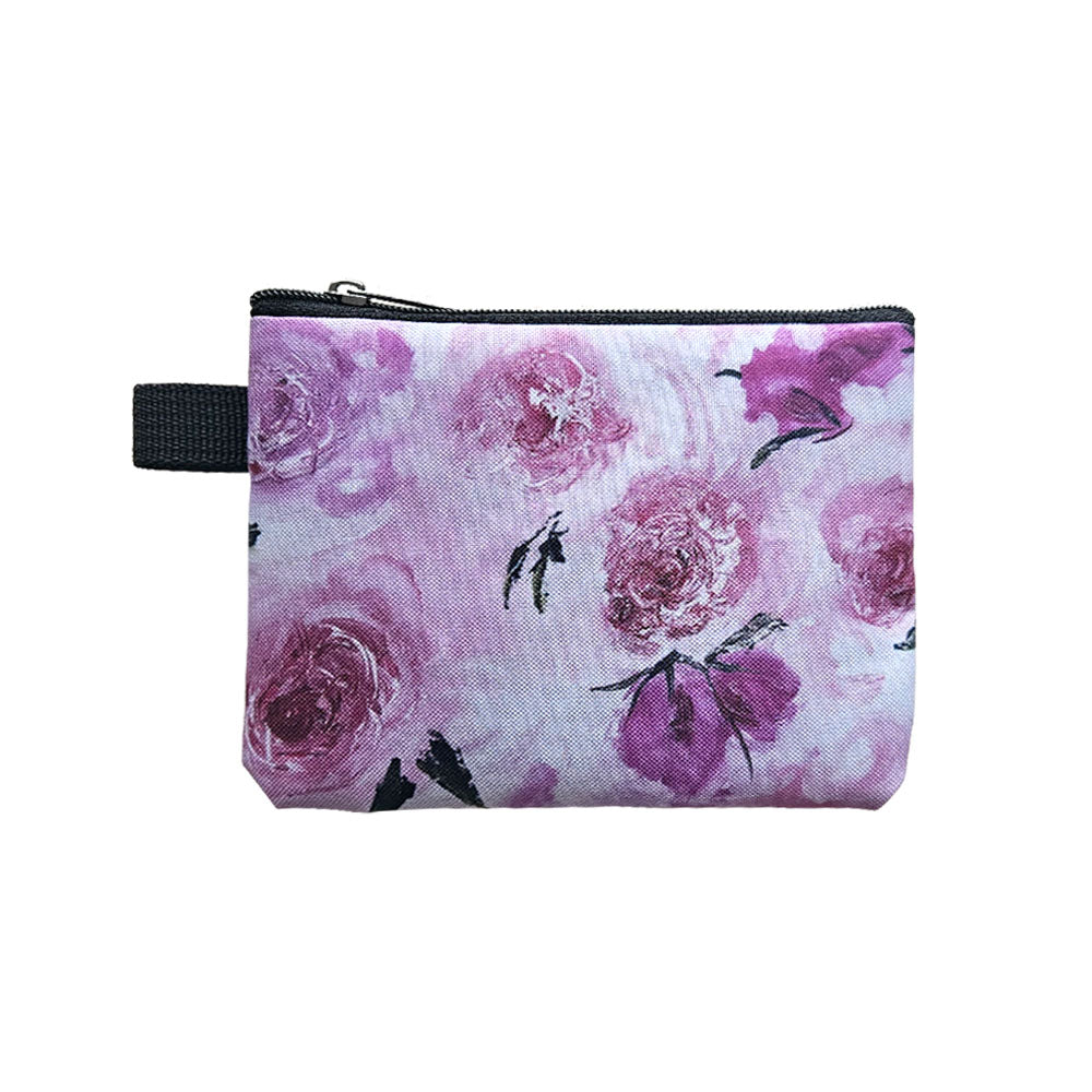 A fabric coin purse with a pink rose floral design.