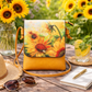 Yellow handbag with sunflower design on a wooden table with sunflowers in the background