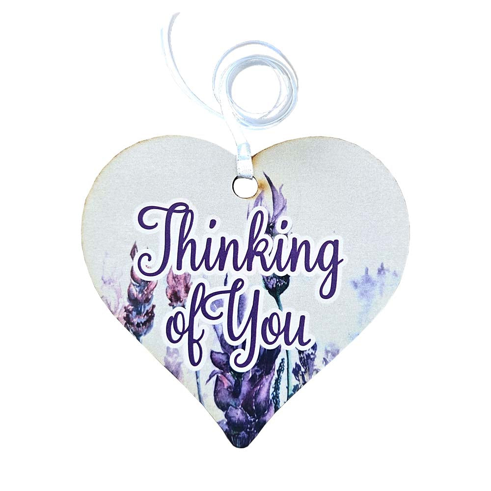 A wooden heart tag with thinking of you written, featuring  lavender flowers.