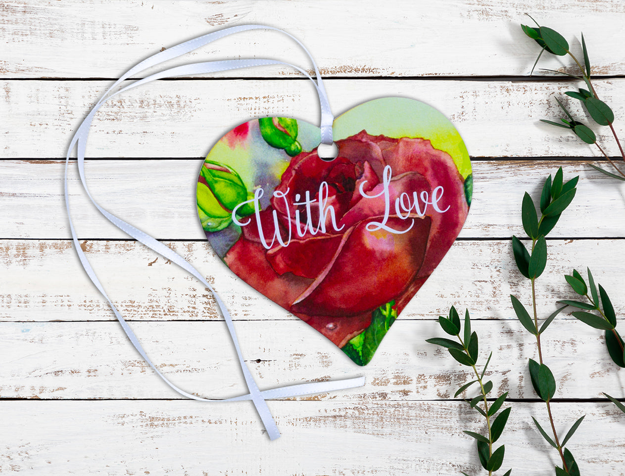 A wooden heart tag with the message 'with love' and a red rose design.